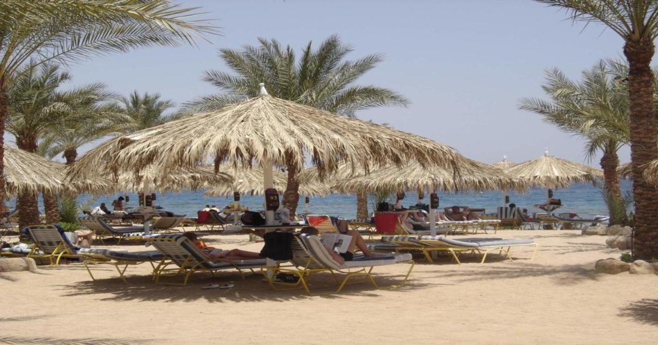ホテル Sharm Dreams Vacation Club - Aqua Park エクステリア 写真 Tourists on the beach at Sharm El Sheikh